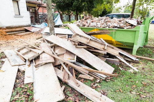 Team of home clearers efficiently removing furniture